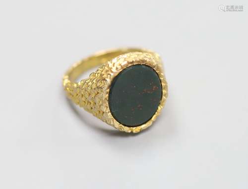 A modern 9ct gold and bloodstone set oval signet ring, with ...