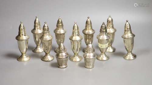 A set of nine weighted sterling pepperettes, 12.5cm and two ...