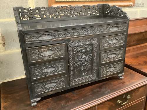 An Edwardian chinoiserie inspired ebonised oak table top cab...