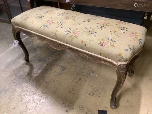 A late Victorian carved and stained beech dressing stool, wi...