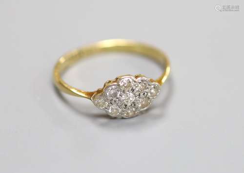 A 1920’s 18ct and plat, nine stone diamond set lozenge shape...