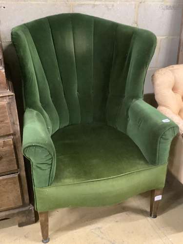 A George III mahogany wing armchair, on squared tapered legs...