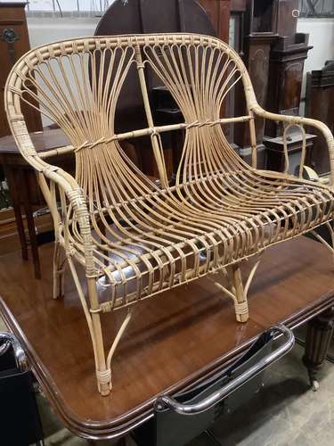 A 1970's bamboo and cane two seater conservatory settee, len...