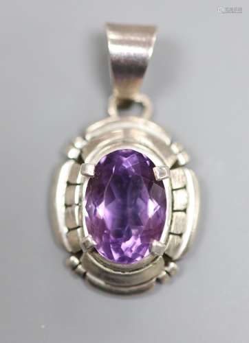 A continental sterling and amethyst set oval pendant, signed...