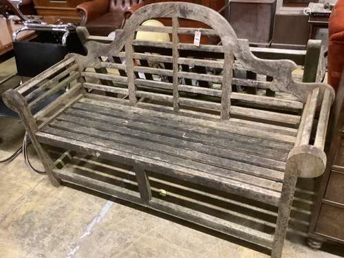 A Lutyens style weathered teak garden bench, length 166cm, d...