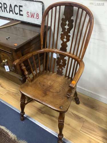 A single early 19th century yew and elm elbow chair, width 5...