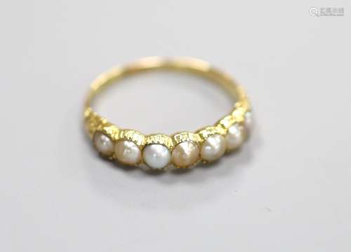 A late Victorian yellow metal and split pearl set half hoop ...