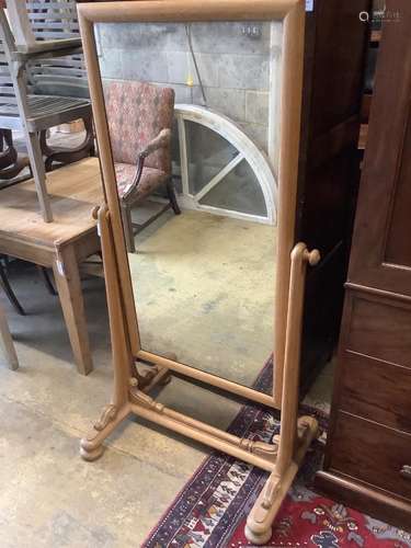 A large 19th century continental pale oak cheval mirror, wit...