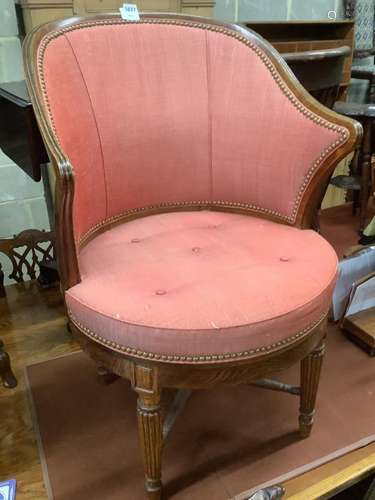 A Victorian oak revolving desk chair, by Waring & Sons Ltd o...