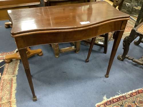 A George III style mahogany serpentine folding card table, w...