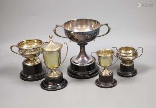 A collection of five small silver presentation trophy cups,l...