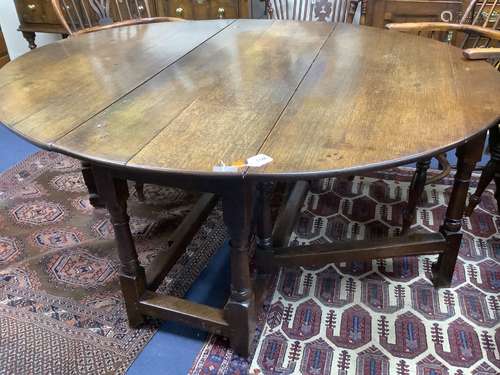 A late 17th century oak oval topped gateleg table