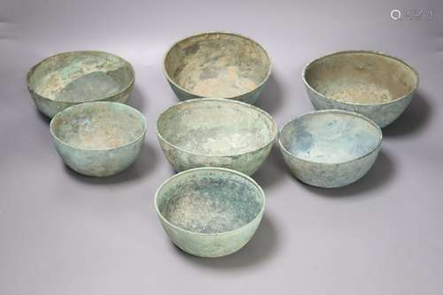 Seven Cambodian bronze ritual offering or water bowls, Khmer...