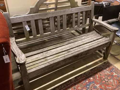 A weathered teak wooden garden bench, length 154cm, depth 56...