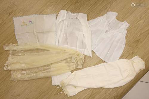 A 1920's needle run embroidered christening gown, on cream n...