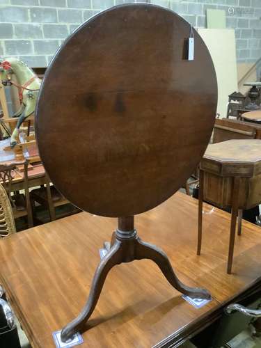 A George III oak tilt top birdcage tea table, diameter 75cm,...