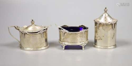 A George VI silver three piece condiment set, by Walker & Ha...