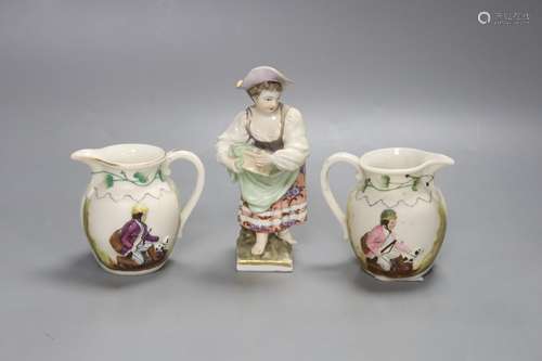 A 19th century Berlin figure, 14cm high and two small jugs