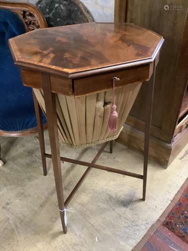 A George III banded mahogany octagonal topped work table, wi...