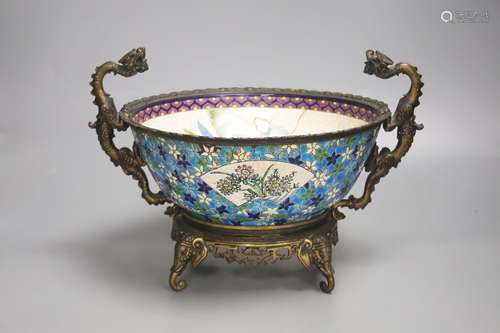 A 19th century French ormolu mounted faience bowl on ornate ...