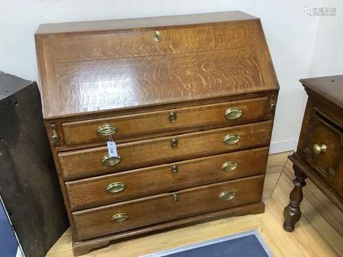 A late 18th century mahogany banded oak bureau, width 100cm,...