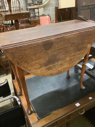 An early 18th century oak oval topped gateleg pad foot dinin...