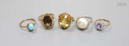 Five assorted modern 9ct gold and gem set rings, including t...