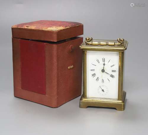 A French brass carriage alarm timepiece in leather case, 11c...