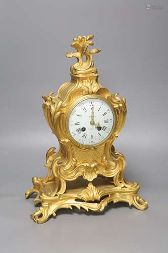 A late 19th-century French rococo revival gilt mantel clock,...