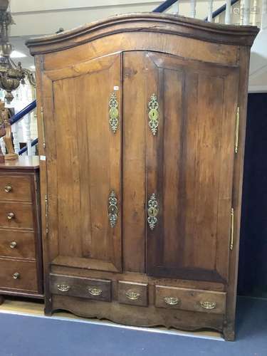 A large French knock-down armoire, with twin panelled doors ...