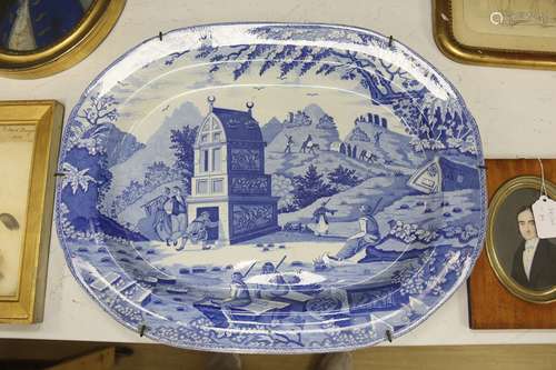 An Orientalist blue and white meat platter, c.1820-40, 52cm