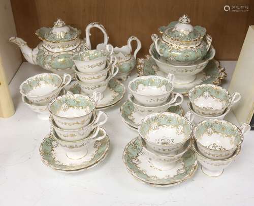 An English porcelain eau-de-nil gilt decorated tea service, ...