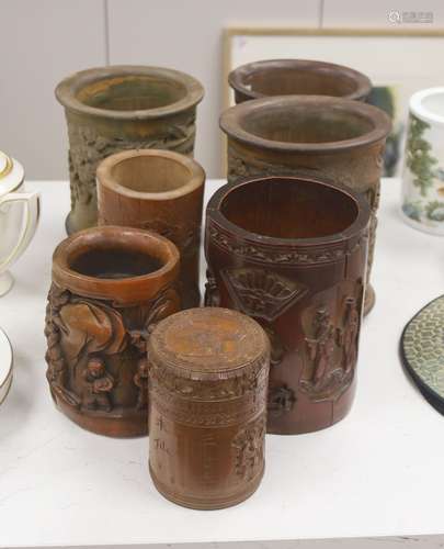 Six 19th/20th century Chinese carved brush pots and a simila...