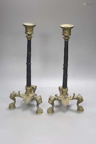 A pair of ormolu candlesticks, with lion paw feet, height 32...