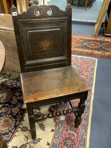 A 17th century oak back stool with bobbin front stretcher, w...