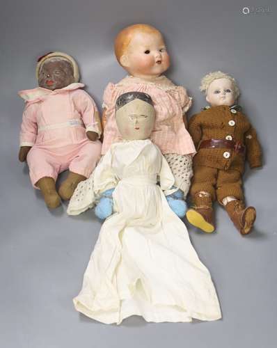 A collection of four dolls including an AM bisque head doll,...