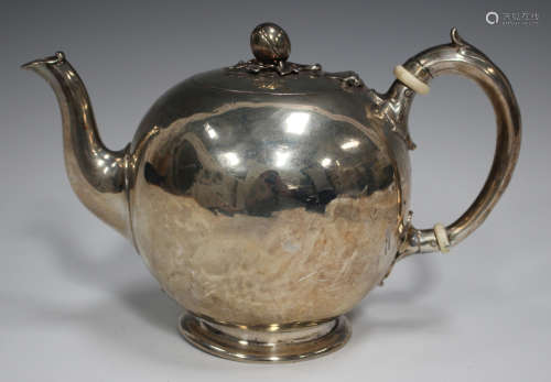 A Victorian silver teapot of bullet form with hinged lid and...