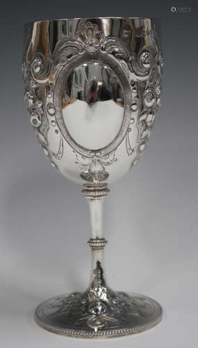A late Victorian silver goblet, the U-shaped bowl with three...