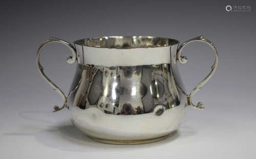 A George V silver two-handled porringer of low-bellied circu...