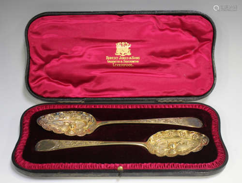 A pair of George III silver gilt Old English pattern serving...