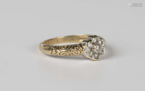 A 9ct gold and diamond seven stone cluster ring, mounted wit...