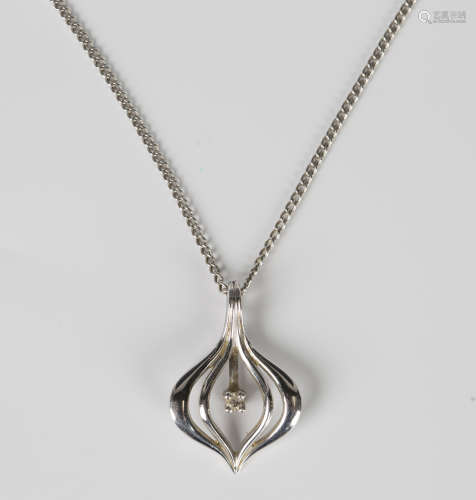 A diamond single stone pendant in a pierced openwork design,...