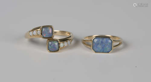 A 9ct gold, opal doublet and opal cross-over ring, weight 2....