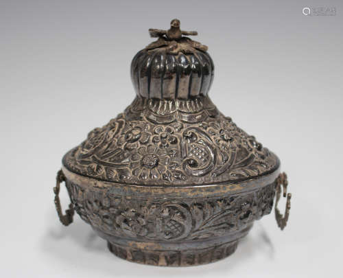 An Egyptian silver oval box with embossed floral and scroll ...