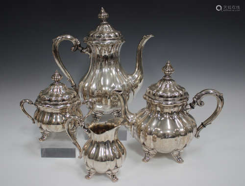 A Continental .835 silver tea service, comprising teapot, ho...