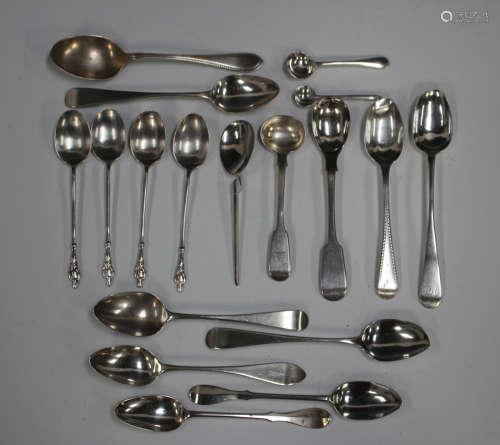 A small collection of assorted silver tea and coffee spoons,...