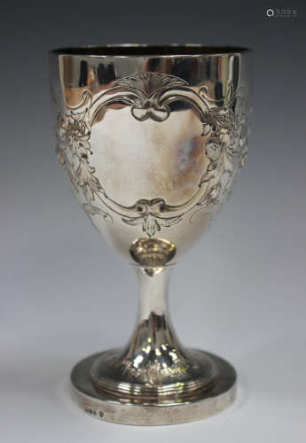 A George III silver goblet, the ovoid bowl later chased with...
