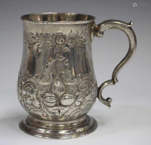 A George III silver baluster tankard with later repoussé flo...