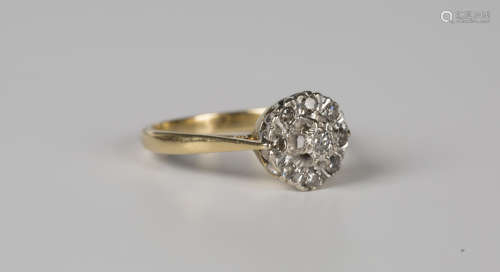 A gold and diamond nine stone cluster ring, mounted with cir...