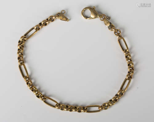 A gold bracelet in a bar and circular link design, detailed ...